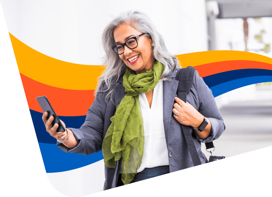 Happy person using their expense management software on their mobile device on the go